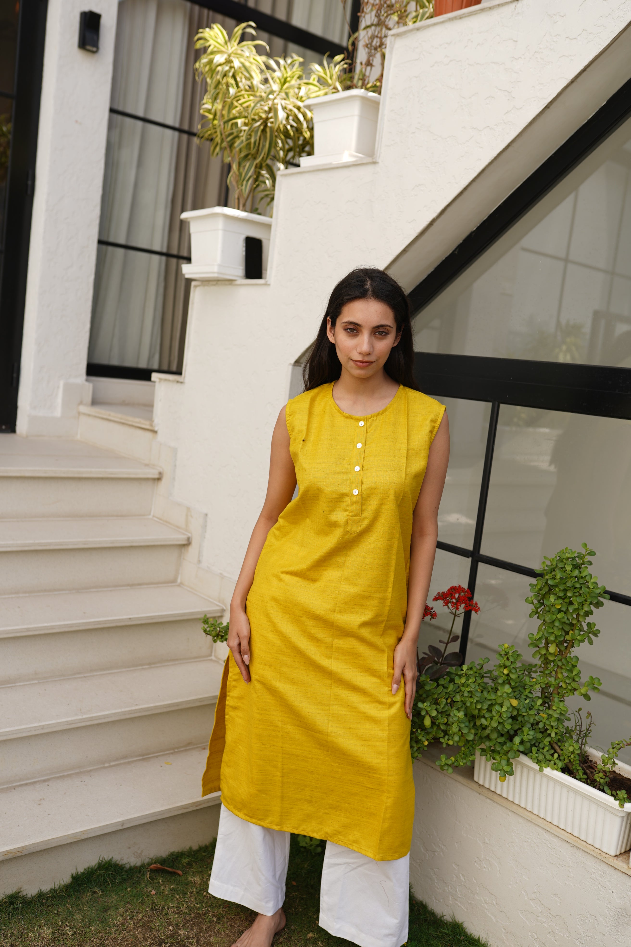 Women Solid Mustard Yellow Sleeveless Cotton Blend Kurta with Front Button Detailing